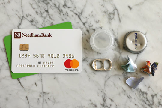 Small non-recyclable items including bottle caps and paper pieces