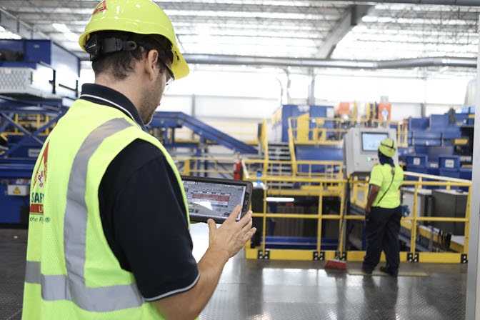 Employee-safety-vest-with-tablet-recycling center