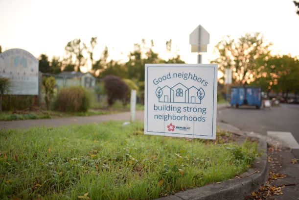 Good neighbors sign in grass