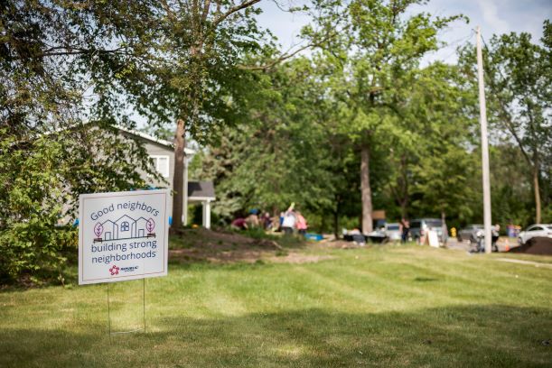 neighborhood promise sign on the lawn