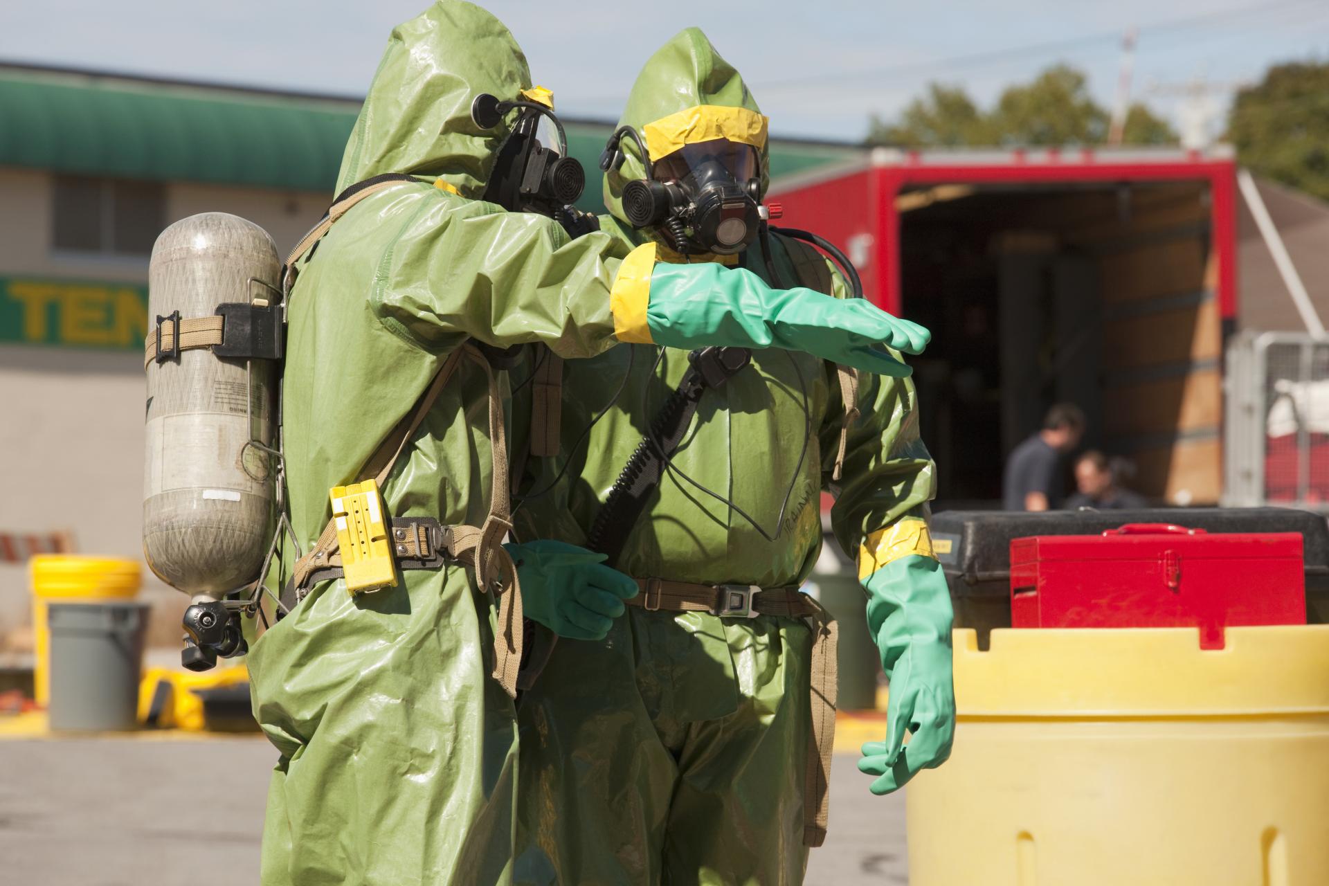 workers in hazmat suites
