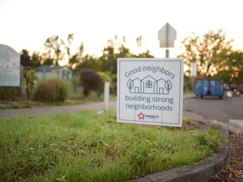Good neighbors sign in grass
