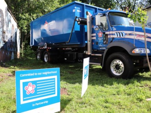 blue Republic Services truck parked on grass