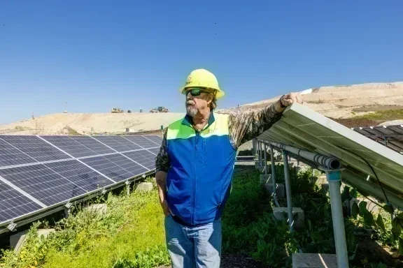 employee by solar panels
